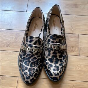 Ladies leopard print slip on loafers with gold chain detail, size 8 M.